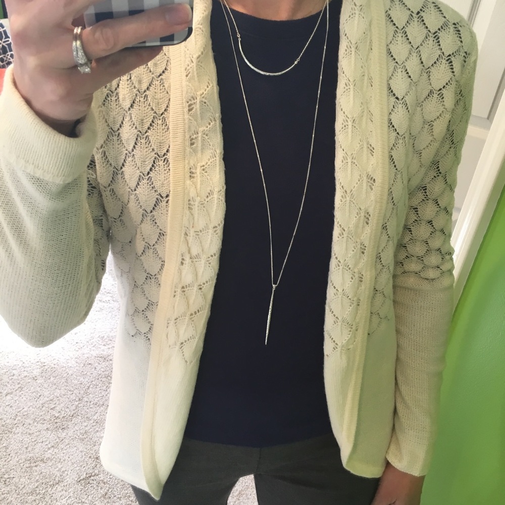 Cardigan sweater, cream with detail, size small.